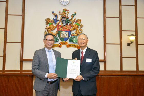 Prof. Y.L. Choi (right) receiving a Certificate of Appreciation from Ir. Ricky Lau, JP (left)